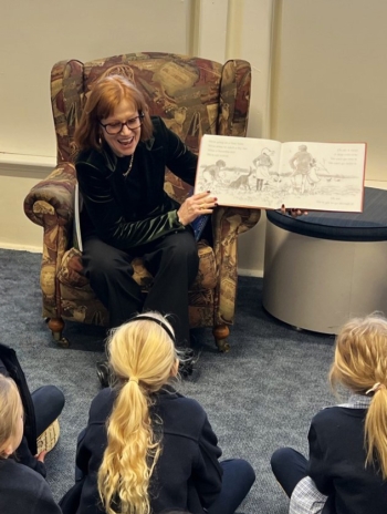 Her Excellency and Professor Chalmers read a book to school children