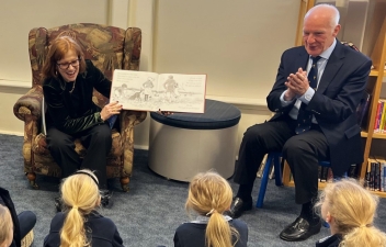 Her Excellency and Professor Chalmers read a book to school children