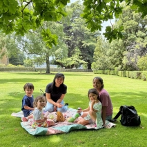 People enjoying a picnic on the lawn at Government House