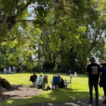 People enjoying a picnic on the lawn at Government House