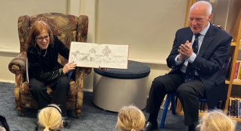 Her Excellency and Professor Chalmers read a book to school children